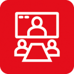 Hybride Veranstaltung Icon - Tisch an dem zwei Personen sitzen die sich in einer Online Konferenz bzw. Meeting befinden
